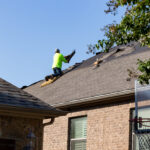 Hauling Shingles up the roof for Alpha Roofing Roof Replacement in Round Rock, TX