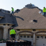 Hauling Shingles up the roof for Alpha Roofing Roof Replacement in Round Rock, TX