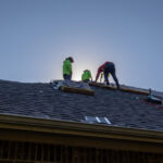 Hauling Shingles up the roof for Alpha Roofing Roof Replacement in Cedar Park, TX