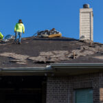 Tearing Off The Old Roof for Alpha Roofing Roof Replacement in Round Rock, TX