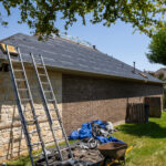 Tearing Off The Old Roof for Alpha Roofing Roof Replacement in Cedar Park, TX