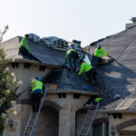 Installing the new roofing materials - Alpha Roofing Roof Replacement in Round Rock, TX